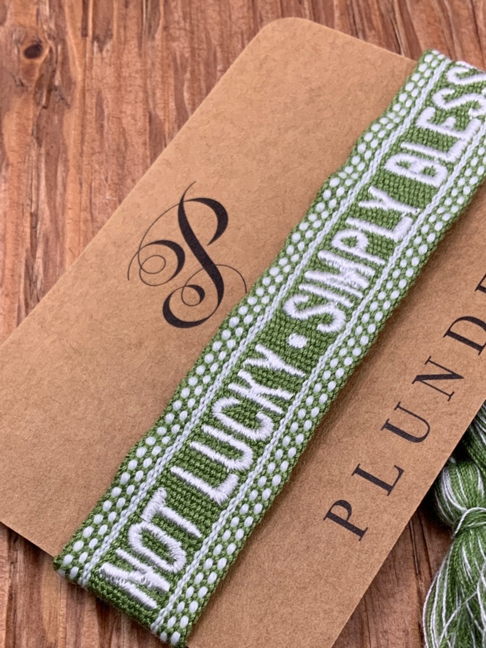 Plunder Design Green and White Woven 'Not Lucky, Simply Blessed' Woven Bracelet